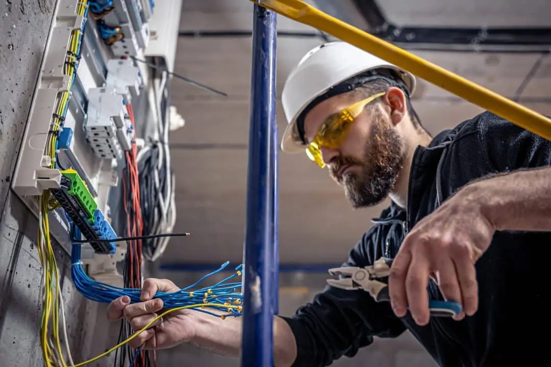 Electrician working in a switchboard