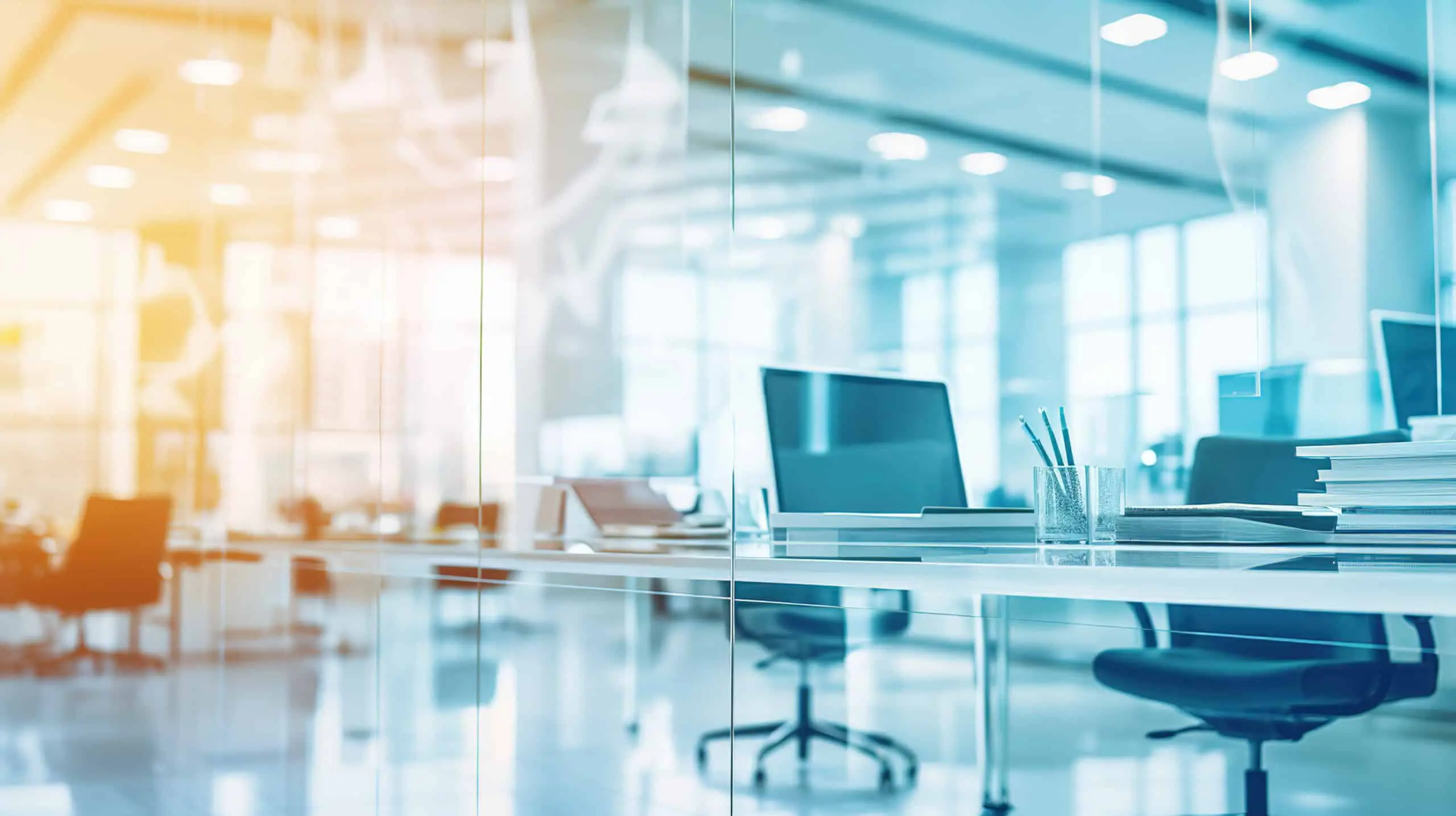 Bright office image with orange and blue tones.